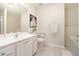 Clean bathroom featuring a modern vanity, a large mirror, and a tub/shower combination at 3068 Lauren Parc Rd, Decatur, GA 30032