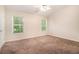 Spacious bedroom with a ceiling fan and natural light from two windows at 3068 Lauren Parc Rd, Decatur, GA 30032