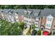 Beautiful townhome exteriors featuring brick and siding, attached garages, and manicured landscaping in a desirable community at 3068 Lauren Parc Rd, Decatur, GA 30032