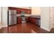Kitchen with stainless steel appliances, wood cabinets, and hardwood floors at 3068 Lauren Parc Rd, Decatur, GA 30032