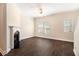 Living room highlighting hardwood floors, a fireplace, and bright windows at 3068 Lauren Parc Rd, Decatur, GA 30032