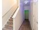 Hallway staircase with carpeted steps and white railings at 3068 Lauren Parc Rd, Decatur, GA 30032