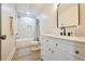 Updated bathroom with white vanity, modern faucet, and shower-tub combo at 455 Saddle Bow Dr, Lawrenceville, GA 30046