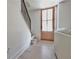 Bright entryway with hardwood floors, staircase, and natural light from the front door at 455 Saddle Bow Dr, Lawrenceville, GA 30046