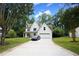 Charming two-story white home with well-maintained lawn, driveway and front yard at 455 Saddle Bow Dr, Lawrenceville, GA 30046