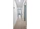Hallway features light wood floors and white walls with modern fixtures at 455 Saddle Bow Dr, Lawrenceville, GA 30046