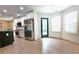 Modern kitchen boasts stainless steel appliances, white cabinets, and a light-filled dining area at 455 Saddle Bow Dr, Lawrenceville, GA 30046