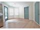 Bright living space with ample natural light, hardwood floors, and stylish blue doors at 455 Saddle Bow Dr, Lawrenceville, GA 30046