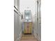 Stylish powder room with modern fixtures and wood grain vanity cabinet at 455 Saddle Bow Dr, Lawrenceville, GA 30046