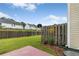 Fully fenced backyard featuring a green lawn and a concrete patio that's perfect for outdoor enjoyment at 2924 Greyhawk Ln, Cumming, GA 30040