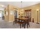 Inviting dining room featuring neutral paint, a decorative chandelier and a dark wood dining table set for four at 2924 Greyhawk Ln, Cumming, GA 30040