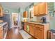 Well-lit kitchen features wood cabinets, stainless steel appliances, and durable floors at 2924 Greyhawk Ln, Cumming, GA 30040
