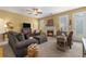 Inviting living room featuring a fireplace, comfortable seating, and lots of natural light at 2924 Greyhawk Ln, Cumming, GA 30040