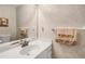 Cozy bathroom features a vanity with generous counter space, a large mirror, and ample lighting at 3866 Teresa Sw Ter, Lilburn, GA 30047
