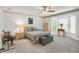 Spacious bedroom with a bay window, chandelier, and music setup, offering both comfort and functionality at 3866 Teresa Sw Ter, Lilburn, GA 30047