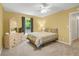 Bright bedroom with a comfortable bed, dresser, and a sunny window, offering a tranquil retreat at 3866 Teresa Sw Ter, Lilburn, GA 30047