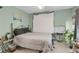 Neutral bedroom featuring a cozy bed, a large window, and minimal decor, creating a peaceful environment at 3866 Teresa Sw Ter, Lilburn, GA 30047