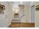 Inviting foyer with hardwood floors, staircase with white railing, and neutral wall colors creating a bright, welcoming space at 3866 Teresa Sw Ter, Lilburn, GA 30047