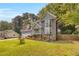 Well-maintained two-story home with beautiful landscaping, a long driveway, and complemented by mature trees in the backyard at 3866 Teresa Sw Ter, Lilburn, GA 30047