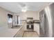 Well-lit kitchen with stainless steel appliances, white cabinets, and a cozy atmosphere at 3866 Teresa Sw Ter, Lilburn, GA 30047