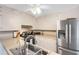 Bright kitchen boasts stainless steel appliances, light countertops, and ample cabinet space at 3866 Teresa Sw Ter, Lilburn, GA 30047