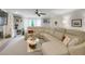 Bright living room featuring custom built-in shelving, a cozy fireplace, and a large, comfortable sectional sofa at 3866 Teresa Sw Ter, Lilburn, GA 30047