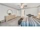 Spacious bedroom with carpet, dresser, mirror, and ceiling fan with chandelier at 3866 Teresa Sw Ter, Lilburn, GA 30047