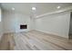 Finished basement featuring a modern fireplace and recessed lighting at 5023 Rockborough Trl, Norcross, GA 30071