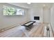 Finished basement with a fireplace, natural light, and room for future customization at 5023 Rockborough Trl, Norcross, GA 30071
