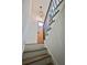 Entryway featuring neutral paint, wood stairs, a wood door, and a decorative light fixture at 5023 Rockborough Trl, Norcross, GA 30071