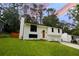 Charming renovated home boasting a freshly painted exterior, modern windows, and manicured lawn at 5023 Rockborough Trl, Norcross, GA 30071