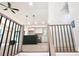 Open-concept living space featuring a modern kitchen, new appliances, island with barstool seating, and stylish lighting at 5023 Rockborough Trl, Norcross, GA 30071