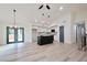 Open-concept kitchen and dining area featuring stainless appliances, center island, and stylish lighting fixtures at 5023 Rockborough Trl, Norcross, GA 30071
