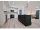 Kitchen with stainless appliances, island, modern fixtures, open layout, and bright interior at 5023 Rockborough Trl, Norcross, GA 30071