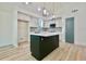 Bright kitchen boasting an island with quartz countertops and modern pendant lighting at 5023 Rockborough Trl, Norcross, GA 30071