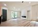Bright living room with vaulted ceilings, modern fireplace, and new flooring, creating a warm and inviting space at 5023 Rockborough Trl, Norcross, GA 30071