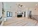 Open-concept living space featuring hardwood floors, pendant lights, and a kitchen island at 5023 Rockborough Trl, Norcross, GA 30071