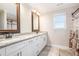 Bathroom with white vanity, granite countertop and double sink and deer-themed shower curtain at 92 River Walk Pkwy, Euharlee, GA 30145
