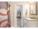 Bathroom with a white vanity and decorative baseball themed shower curtain at 92 River Walk Pkwy, Euharlee, GA 30145