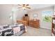 Bedroom featuring a wooden bed frame, carpet and warm colored dressers at 92 River Walk Pkwy, Euharlee, GA 30145