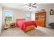 Bedroom with carpet, two windows, a ceiling fan and a bonus closet and storage cabinet at 92 River Walk Pkwy, Euharlee, GA 30145