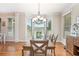 Elegant dining room with hardwood floors, a chandelier, and lots of natural light, great for gatherings at 92 River Walk Pkwy, Euharlee, GA 30145