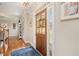 Inviting entryway with a wooden door, sidelights, and hardwood floors, showcasing a warm welcome at 92 River Walk Pkwy, Euharlee, GA 30145