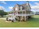 Exterior view of the home featuring a large porch and well-maintained yard at 92 River Walk Pkwy, Euharlee, GA 30145