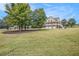 Wide shot of the house with large yard at 92 River Walk Pkwy, Euharlee, GA 30145