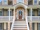 Inviting front porch featuring stone accents and a charming entryway at 92 River Walk Pkwy, Euharlee, GA 30145
