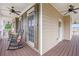 Inviting front porch featuring rocking chairs and ceiling fans, perfect for relaxing outdoors at 92 River Walk Pkwy, Euharlee, GA 30145