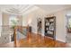 Upstairs hallway with hardwood floors and lots of natural light at 92 River Walk Pkwy, Euharlee, GA 30145