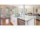 Open concept kitchen with a large island, stainless steel dishwasher, and great natural light at 92 River Walk Pkwy, Euharlee, GA 30145