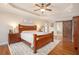 Bedroom showcases hardwood floors, a tray ceiling, and a sliding barn door at 92 River Walk Pkwy, Euharlee, GA 30145